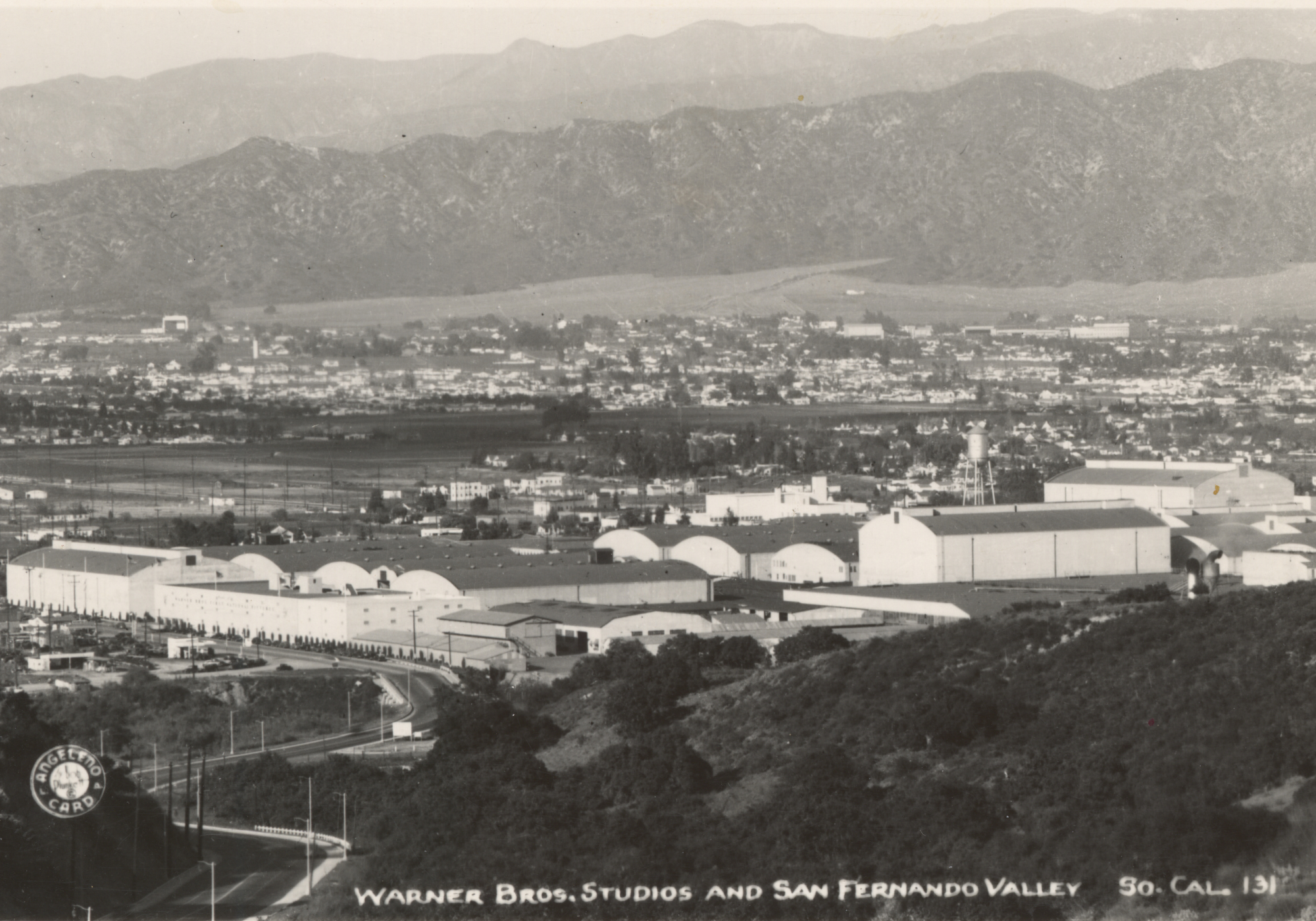Warner Bros. Studios, Burbank, c.1940s. Studio complex with San Fernando Valley and mountains beyond.