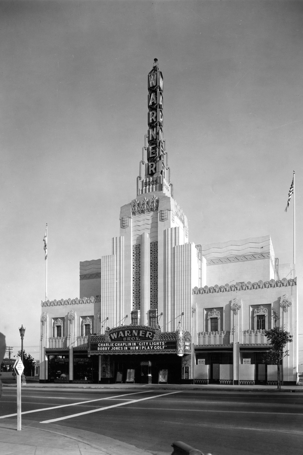 Warner Bros. Theater, Beverly Hills, c.1931. Neon tower, marquee with Chaplin’s City Lights; demolished in 1980s.